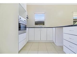 View profile: Charming Gwynneville Property with Spacious Bedrooms, Functional Kitchen, and Expansive